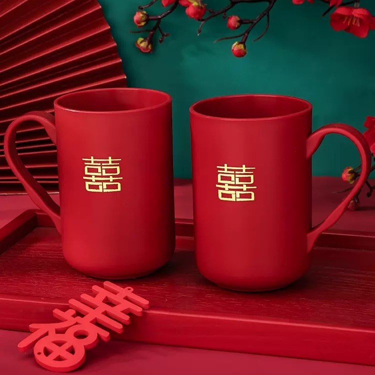 A pair of wedding wine red tooth cups