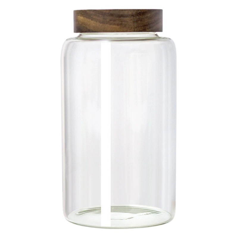 Большая стеклянная банка с крышкой из дерева, с резьбой и герметичной застежкой, для брожения сливо-виноградного вина и хранения сушеной цедры мандарина и зерна.