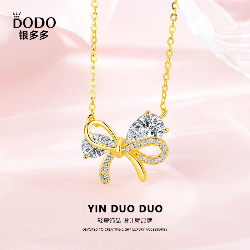 Pendant with bow with zircon