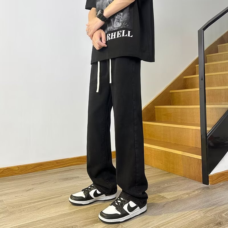 Vaqueros americanos, pantalones teñidos de barro amarillo de seda de hielo viejos lavados de verano para hombres, pantalones rectos sueltos de la marca de moda de la calle principal