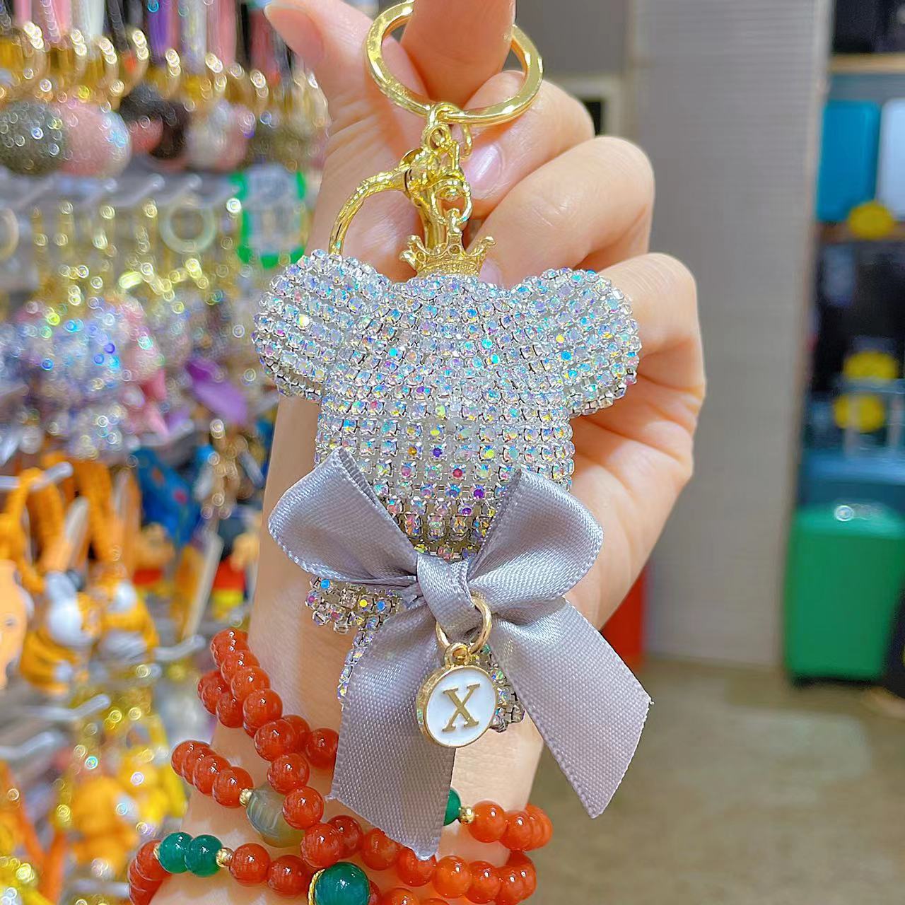 Venta directa de fábrica de lujo completo diamante muñeca llavero pajarita cabeza grande oso completo diamante bolsa colgante coche llavero