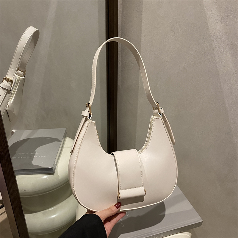 Bolso popular de este año para mujeres 2025, nueva moda de un solo hombro, bolso de diseño de nicho, bolso de media luna debajo de la axila
