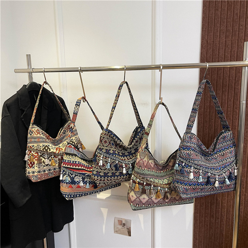 Bolsos de gran capacidad de estilo nacional para mujeres 2025, nueva moda extranjera, bolsas de hombro de borda, bolsas de compras al aire libre