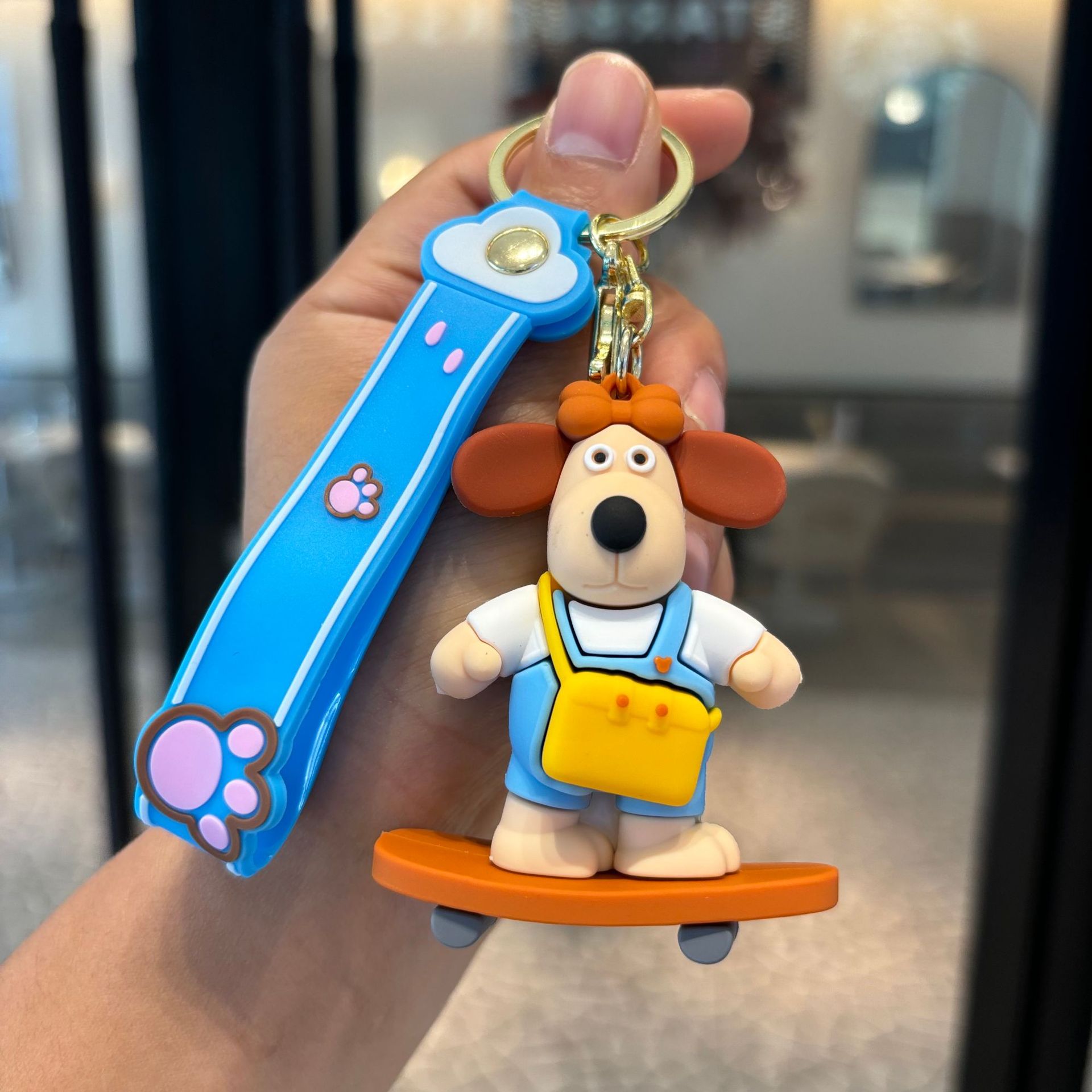 Jefe de perro llavero muñeca colgante llave de PVC pequeño regalo dibujos animados adornos lindos llavero de la máquina