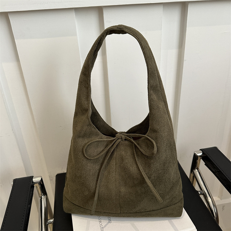 Lazos de nicho coreano estilo de moda ocio retro gamuza viaje de hombro único arco axilar bolsa de moda