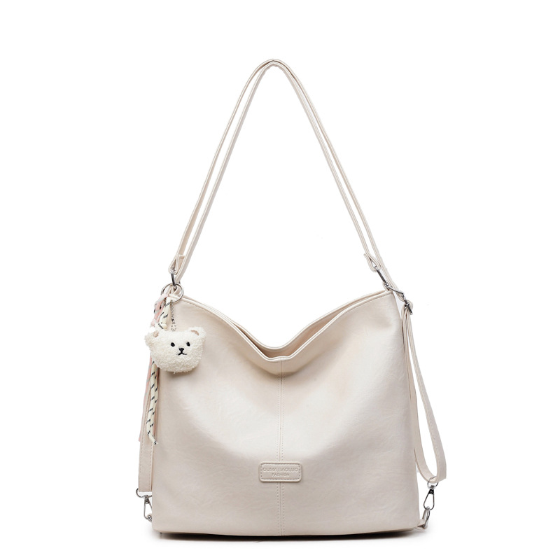 Bolsa de hombro retro transfronteriza de cuero suave de gran capacidad bolsa de cubo de agua para mujeres 2025 nueva simple mochila de viaje ocio