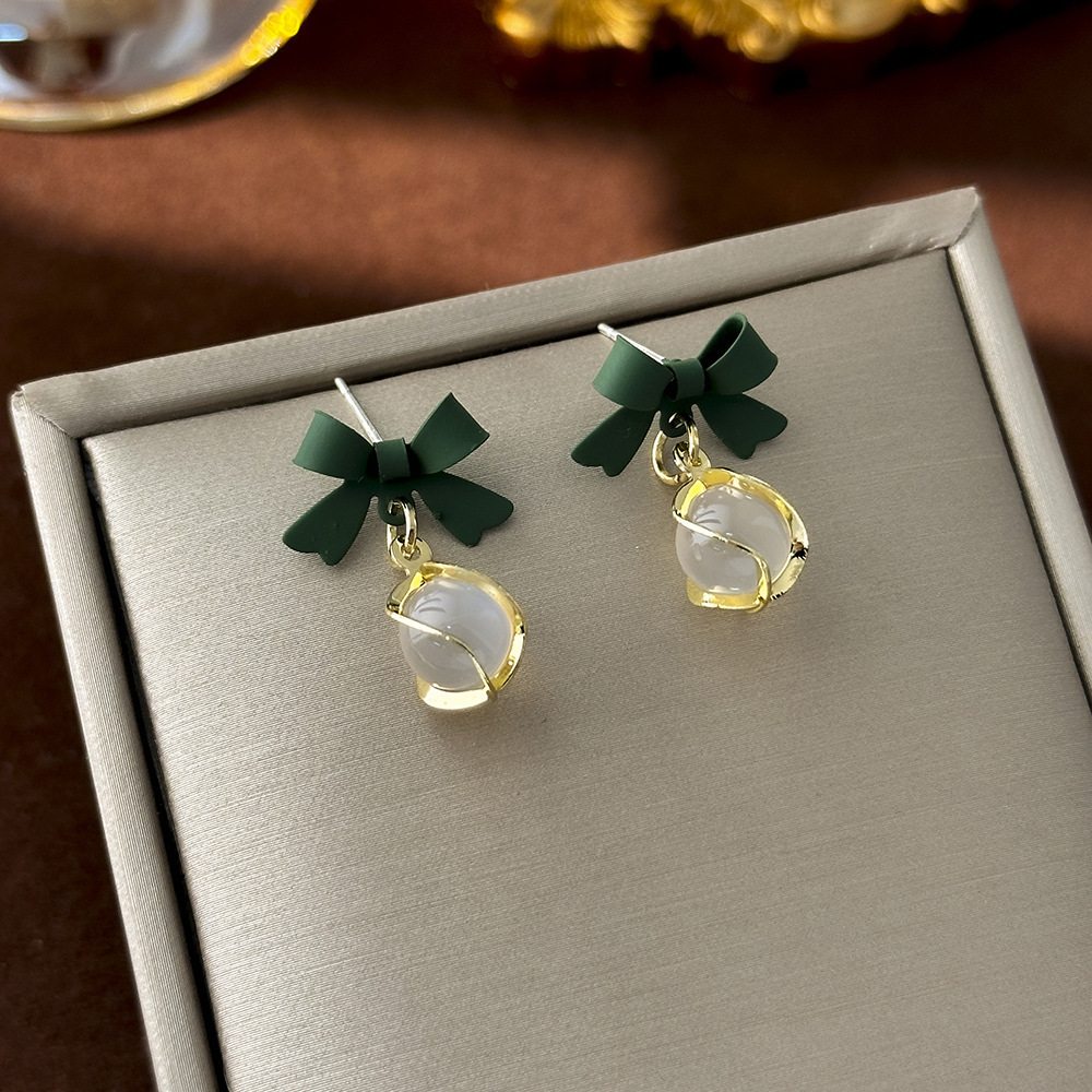 12 # Ojo de gato verde con lazo