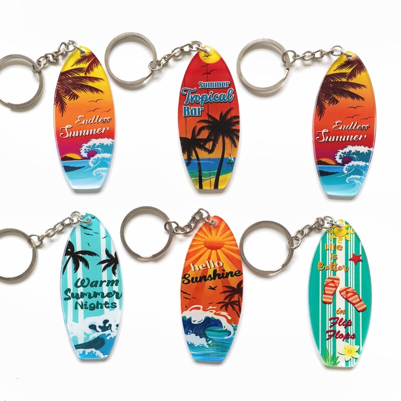 Summer Hawaiian style surfboard keychain in the night sky, beach vacation style summer accessory souvenir
