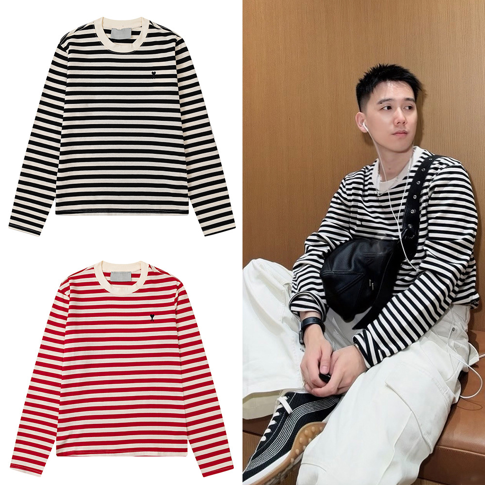 AM* เสื้อยืดแขนยาวทรงหลวม คอกลม ลายทาง สไตล์ชิลๆ ปักลายรูปหัวใจเล็ก คอลเลกชันใหม่ฤดูใบไม้ร่วง–ฤดูหนาว 2026 แบบชายหญิง นำเข้าจากต่างประเทศ