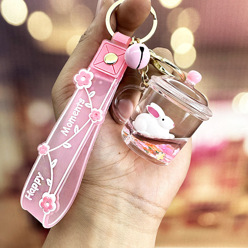 Colgante de llavero de conejo de botella de arena rosa, muñeca flotante creativa, decoración de mochila para niña, regalo exquisito para pareja
