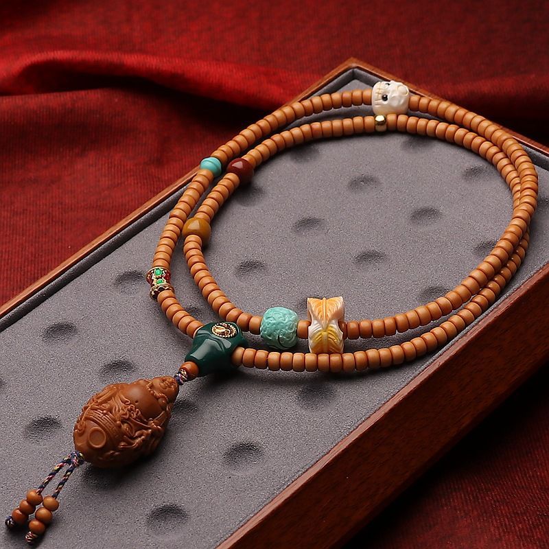 橄榄核手工雕刻多宝鱼弥勒佛核尖直切核壁108佛珠链脖挂文玩颗