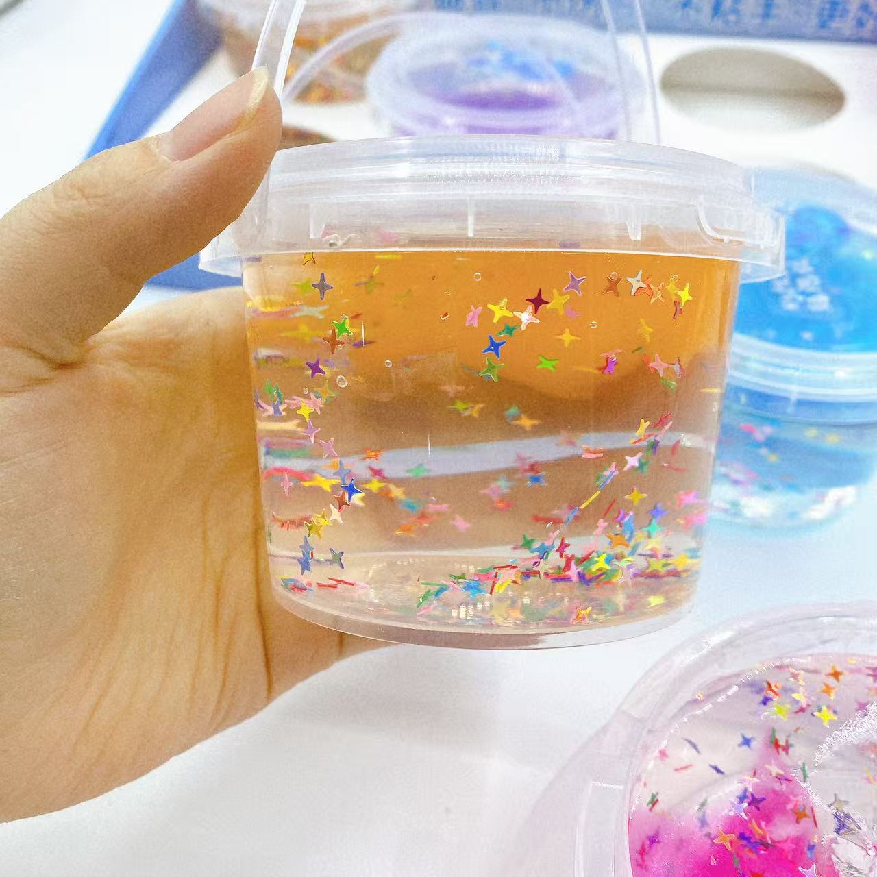 Nuevo barril de alto valor visual de dos colores dibujados espumosos de acero colorido red rojo slime juguetes de niños rompecabezas lote de barro colorido