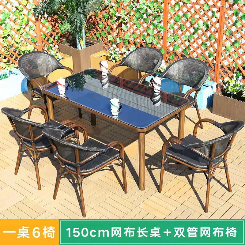 Mesa y silla al aire libre leche tienda de té cafetería silla de malla Silla de ratán Patio de tres piezas balcón mesa y silla de ocio al aire libre