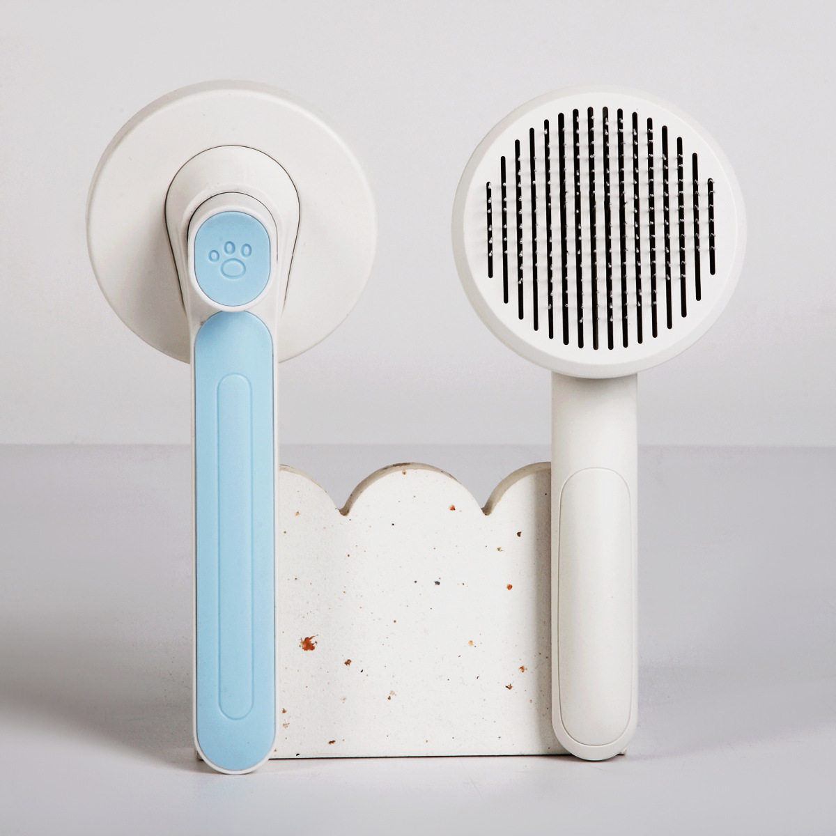 Transfronterizo nuevo peine para mascotas gato y perro universal de limpieza automática de Peine macaron de color mascota flotante peine de masaje para el cabello