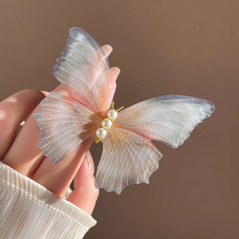 Clip de cabello de mariposa móvil ultra inmortal electrónica azul tulle perla clip de boca de pato decoración accesorios de playa clip tocado