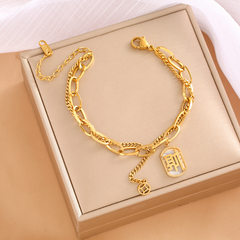 Pulsera de trébol de acero titanium vendedora caliente transfronteriza europea y americana con incrustaciones de concha pulsera colgante pulsera de diseño avanzado sin desvanecimiento al por mayor