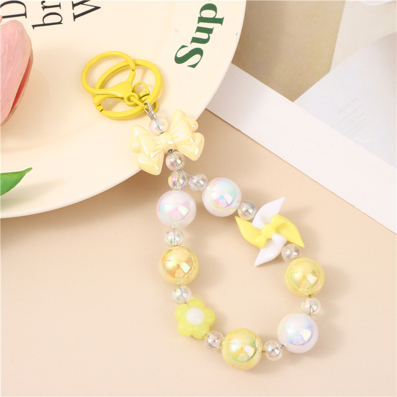 Japón y Corea del Sur color ins hecho a mano con cuentas flor llavero cordón de muñeca macaron color pétalo cordón de teléfono móvil en stock