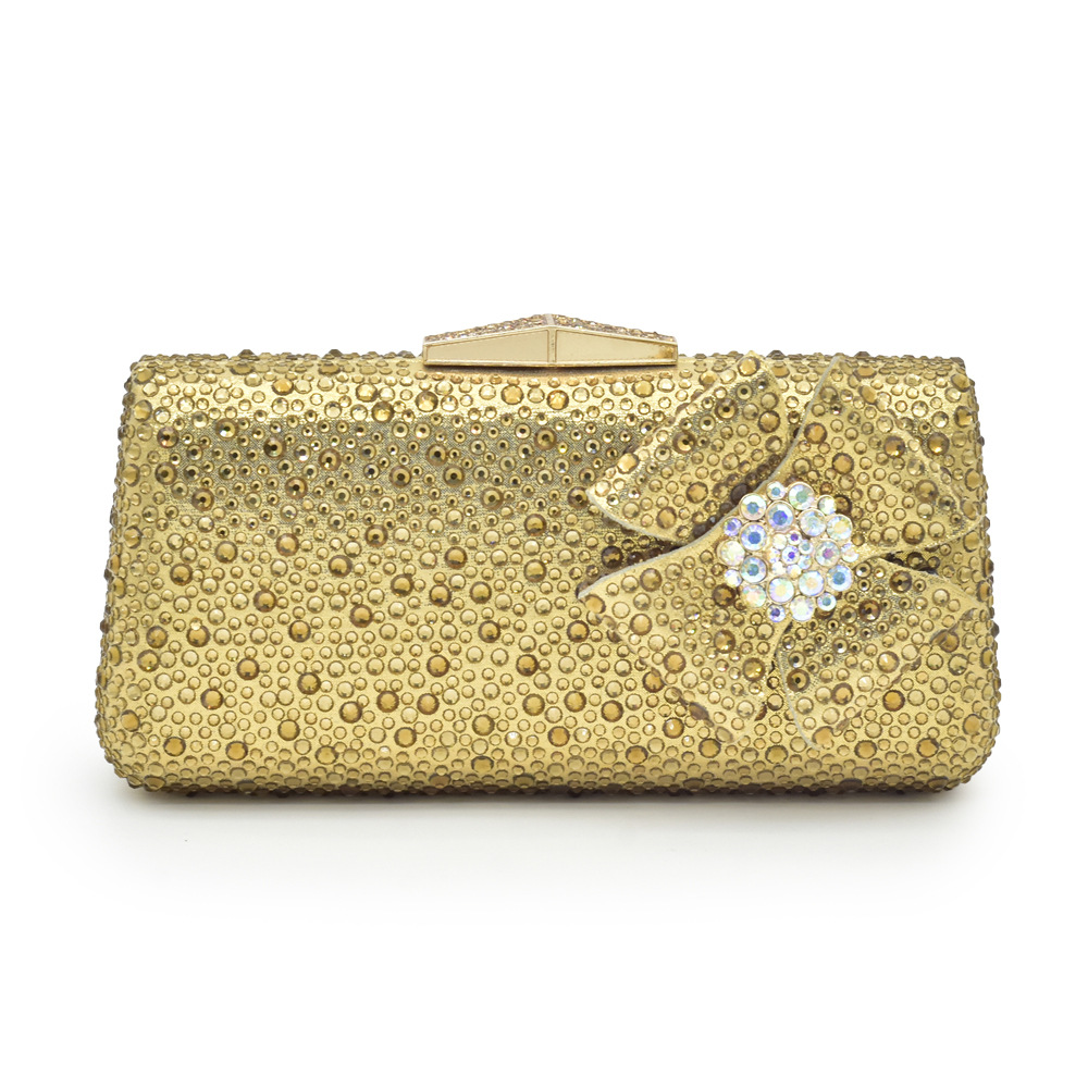 Accessorize the evening with applique studded high-heeled sandals and a full cloth small flash diamond dinner bag set with sandals_voghion.com