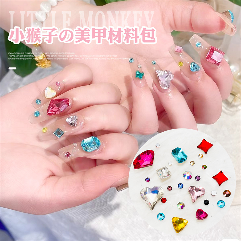 Internet celebridad mono mismo estilo de uñas arte material paquete puntiagudo Fondo hacha en forma de corazón K9 diamante uñas joyas de uñas mixtas