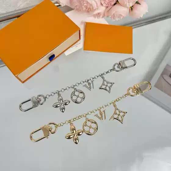Lujia Cross border 25 Year Summer New Luggage Chain Fashion Luxury Zinc Alloy Four Leaf Clover Letter Key Buckle