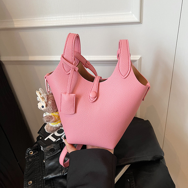 Bolso de cubo de canasta de verduras portátil de gran capacidad de alta calidad para mujer 2025 nuevo bolso de mensajero de hombro de estilo occidental de todo fósforo de moda