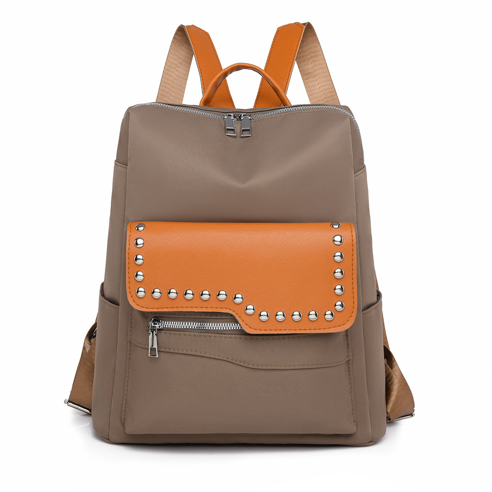 Nueva mochila con remaches para mujer de color en contraste, mochila de viaje simple y versátil de gran capacidad, mochila de viaje al aire libre, al por mayor