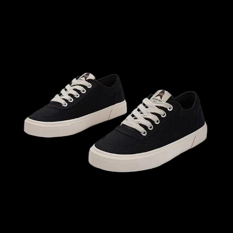 Zapatos de hombre de color sólido zapatos de lona clásicos básicos simples de estilo universal de moda baja zapatos de skate de lazos planos zapatos de mujer