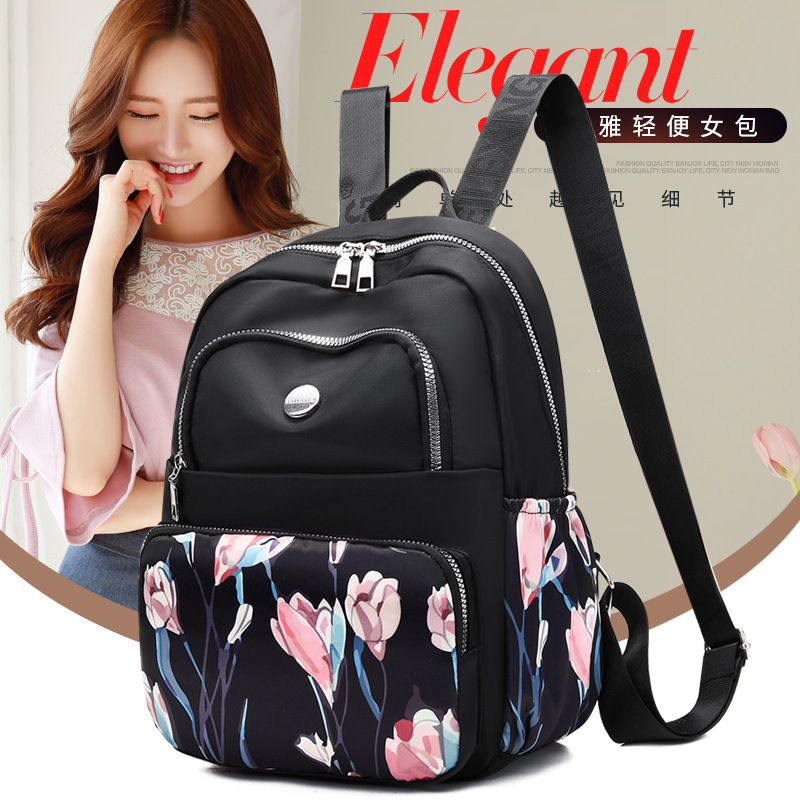 Mochila de las mujeres del verano nuevo ocio viaje gran capacidad moda impreso tela nylon doble espalda en stock