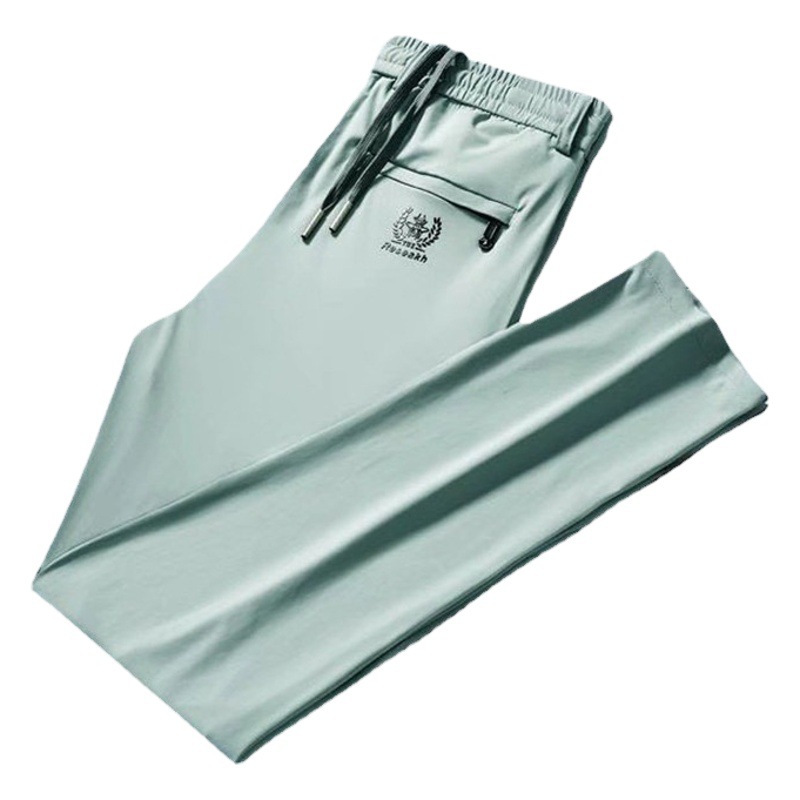 Verano 2025 estilo fino bordado de seda de hielo talla grande pantalones casuales de negocios elásticos pantalones deportivos delgados para hombres pantalones para hombres de moda