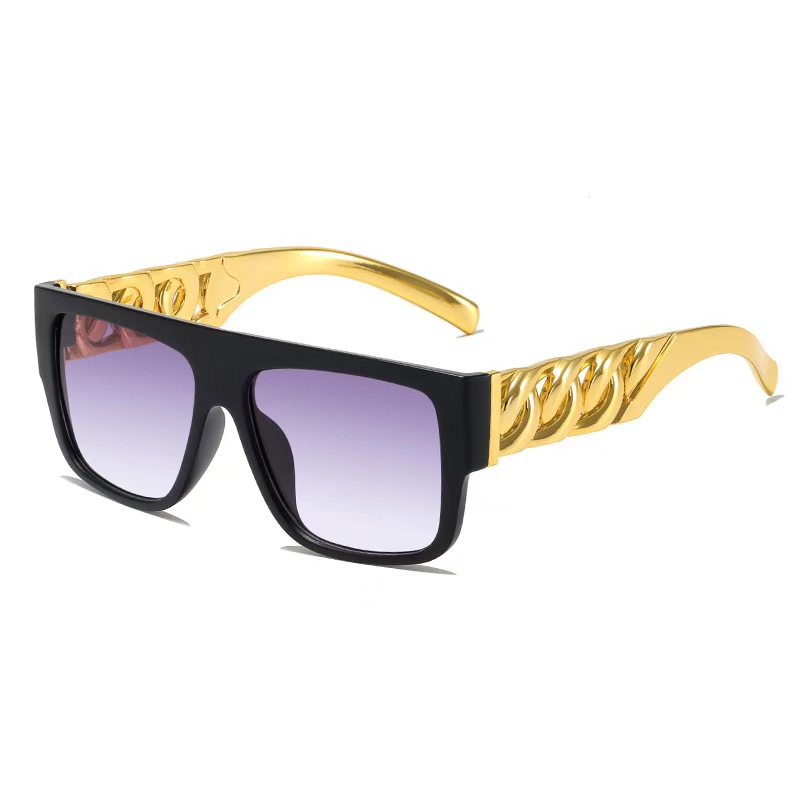 Óculos de sol punk na moda com grandes correntes douradas_voghion.com