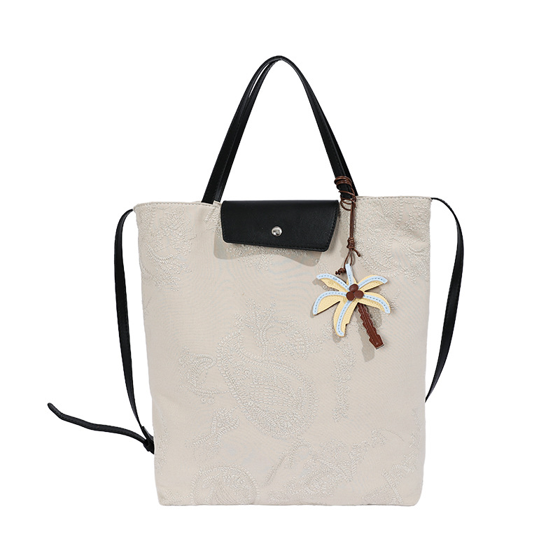 Bolso de mujer 2026 nuevo estilo coreano tela de gran capacidad bolso de mano de viaje simple diario mochila de hombro