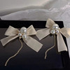 Long hair band from pearl with bow, silver needle with tassels, earrings