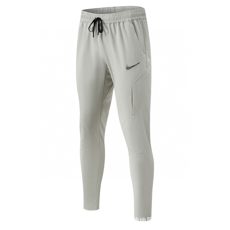 Explosión transfronteriza de un tipo idéntico de tecnología de prevención de tres secado rápido tela casual tela cremallera deportiva de protección solar pantalones de hombre