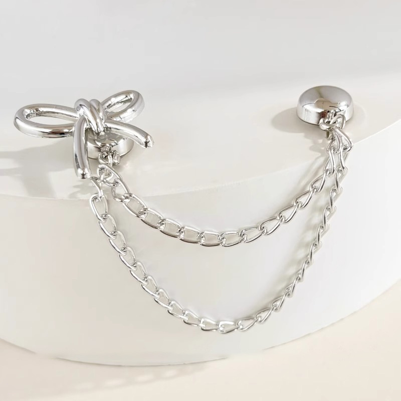 Pendientes de borla con lazo de perlas, diseño de nicho de lujo ligero femenino, clips de oreja de moda de alta gama, pendientes fríos y versátiles