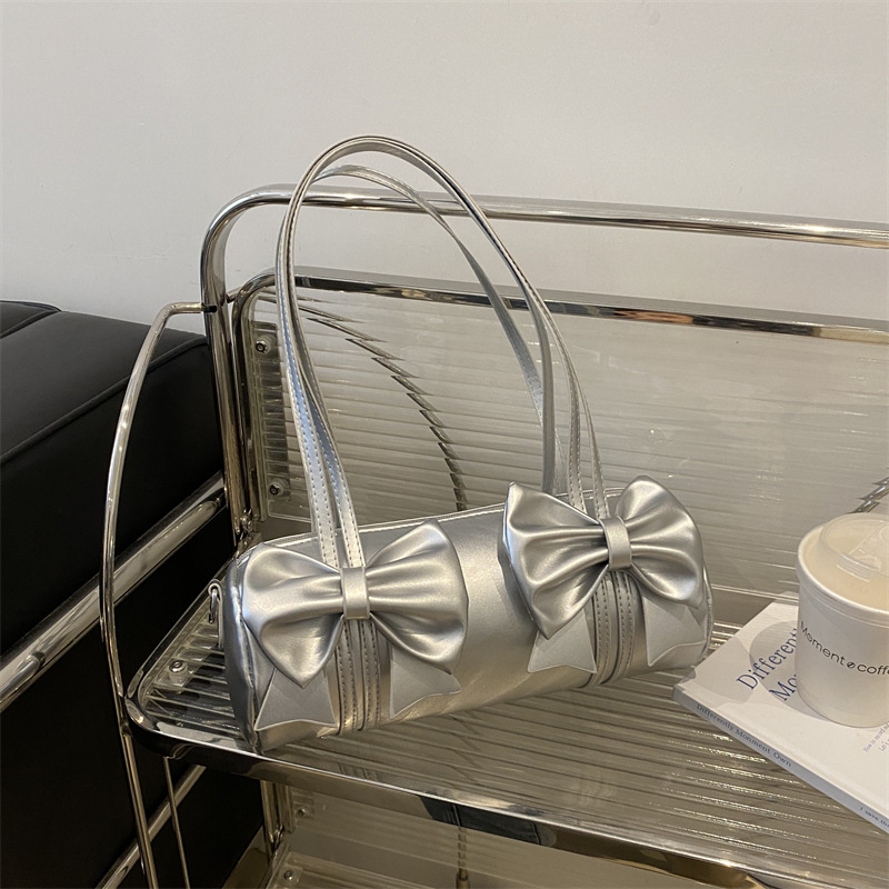 Bolsos debajo de las axilas de la mujer 2024 nuevo estilo de diseño de moda nicho bolso de arco bolso de mano