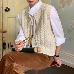 韓国の蝶結びの麻の花のニットのベストのカーディガンの女性の春の新型のゆったりとした重ね着の上着のセーターのベスト