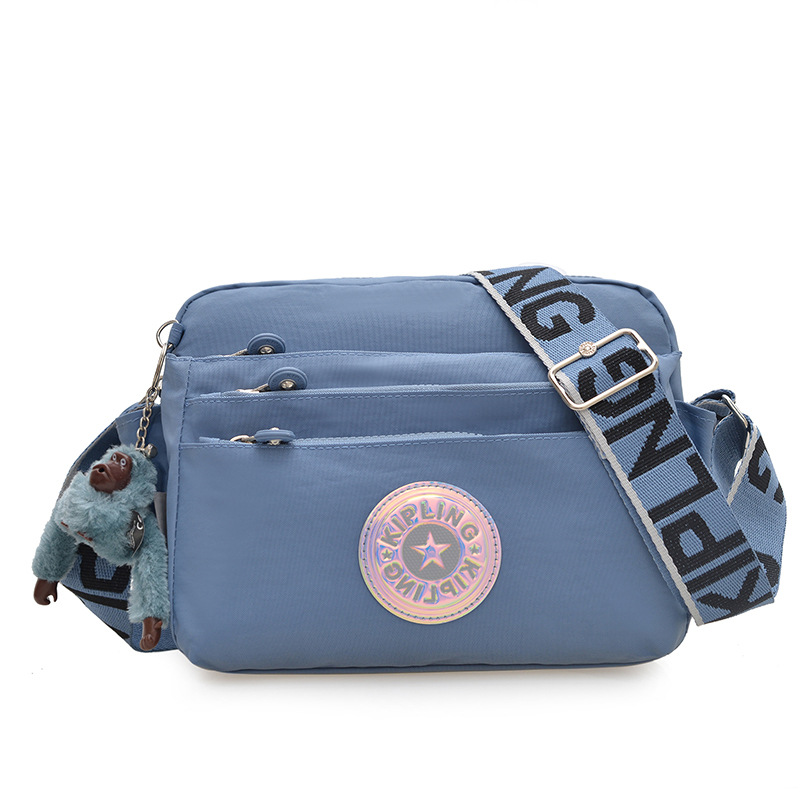 Nuevo bolso de hombro para mujer kp bolso de mensajero de tela de nailon anti-salpicaduras ultraligero nuevo colgante de mono estándar damas compras diagonales