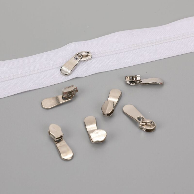 3番ナイロンの頭を引く服のカバンの補助材料の金属の引っ張りは厚い親指の短い板のナイロンの頭を伸ばして供給することができます。|undefined