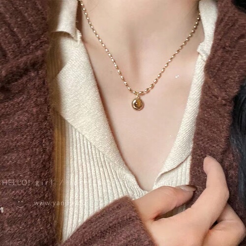 High-end millet tiger eye stone necklace women's autumn and winter retro sweater chain high-end atmospheric long pendant clavicle chain