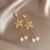 Golden ear clips with tassels, flowered