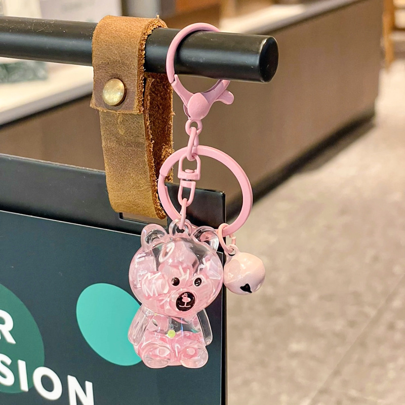 Caricatura en aceite líquido arena flotante botella mochila llavero delicado colgante accesorios accesorios máquina de muñecas pequeños regalos al por mayor