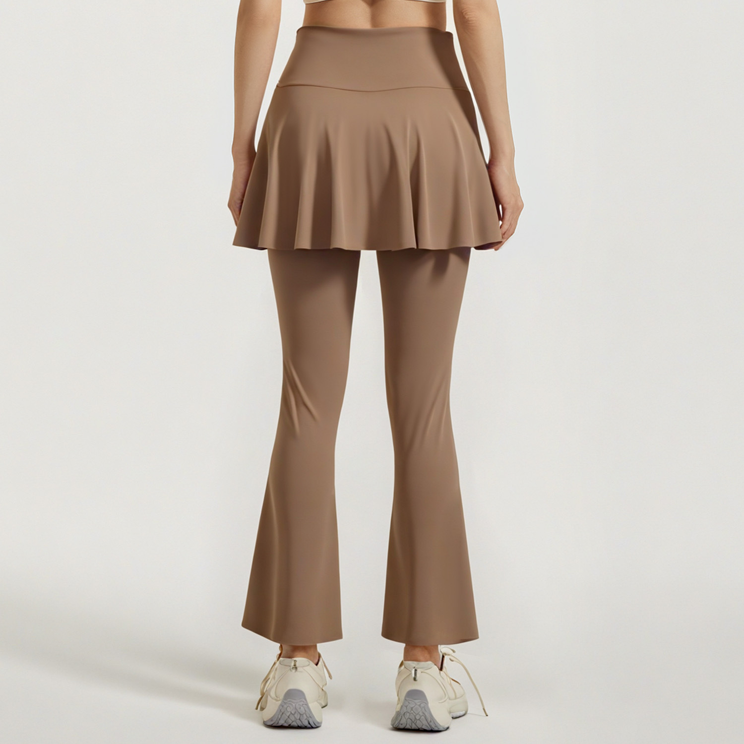 Los nuevos pantalones de falda de cuerno a juego de color de Juyitang son elásticos y delgados, falsos dos pantalones de yoga para correr de cintura alta