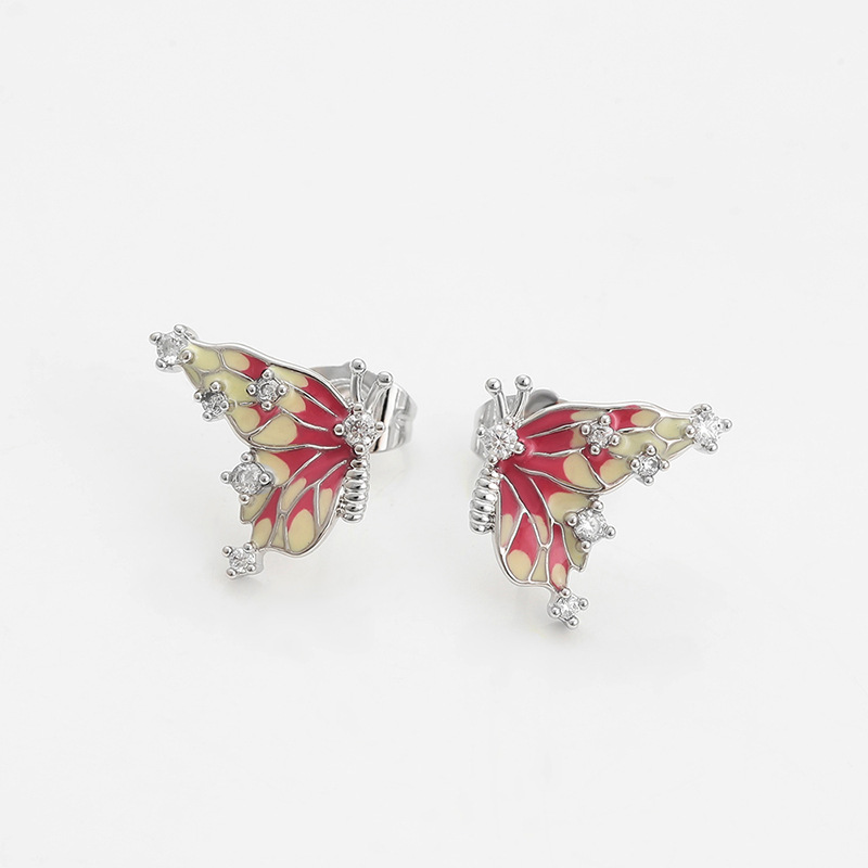 Xuping incrustado joyas artificiales aleación de cobre chapado blanco mariposa pendientes de esmalte de color goteo serie de pendientes al por mayor
