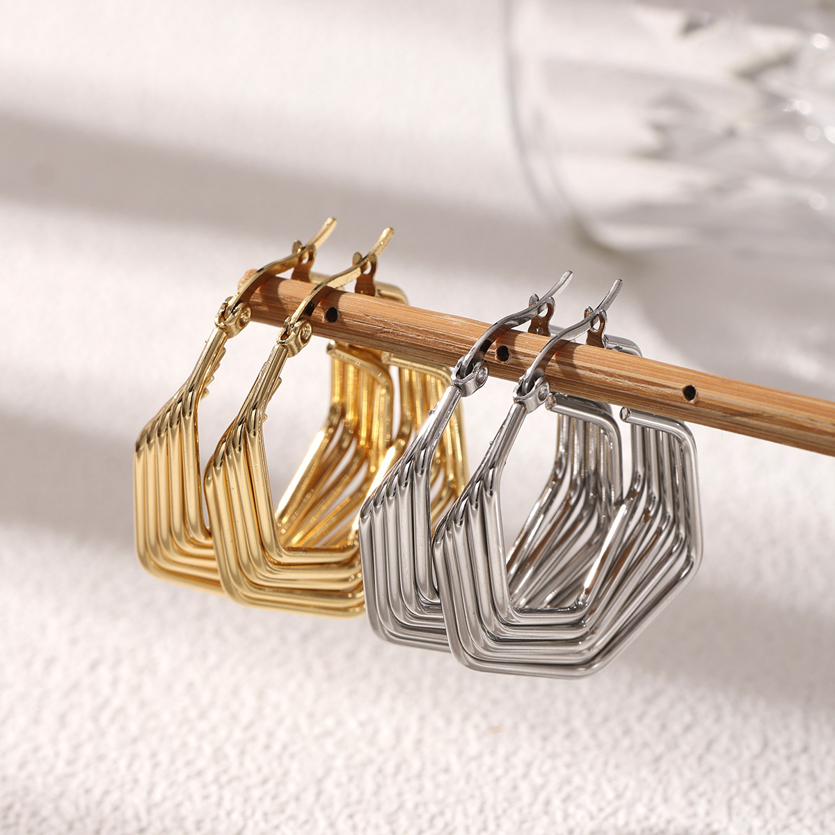 Taina acero dorado de acero inoxidable de alta calidad, nicho, pernos de acero de titanio de estilo femenino, auriculares personales