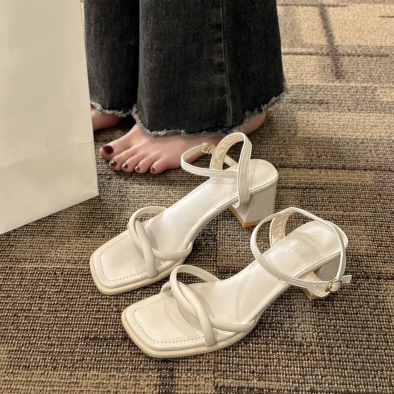 White summer sandals with a strap, suitable with a skirt