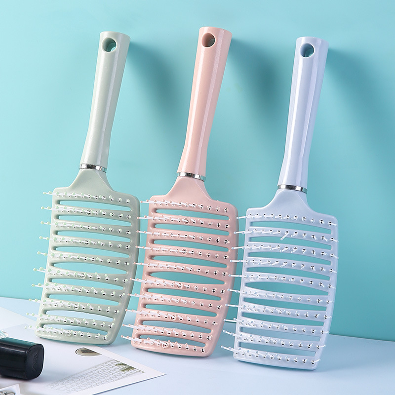 Peine curvo de gran volumen con dientes anchos y huecos para masaje, peinado y masaje del cuero cabelludo.