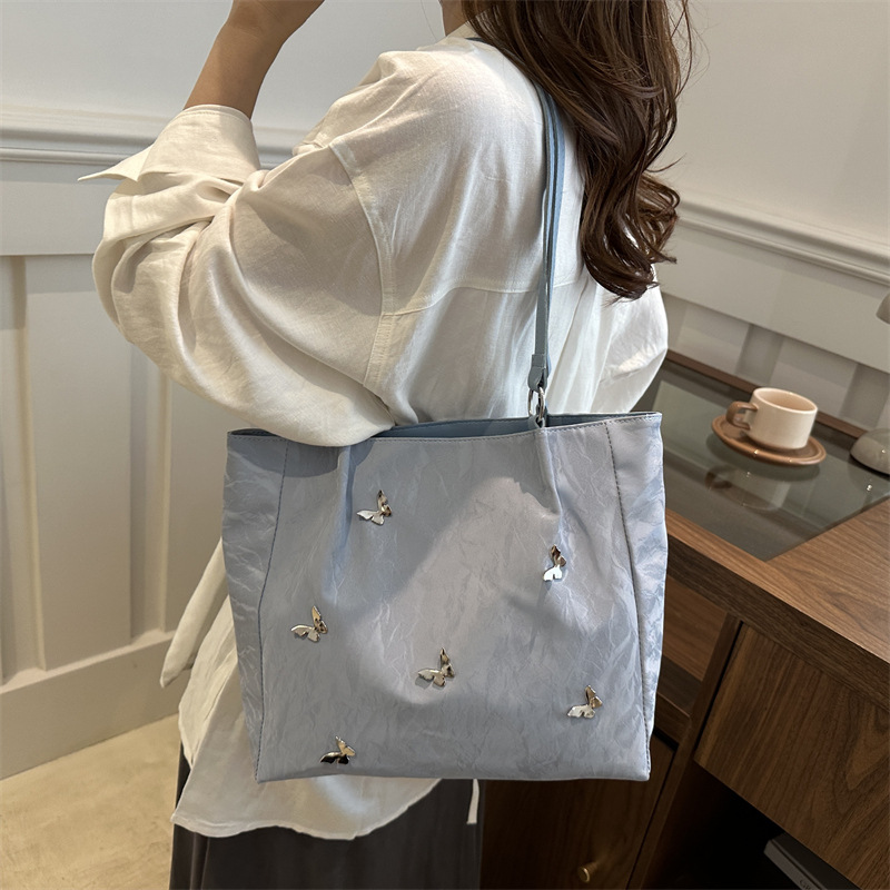 Bolso de viaje popular de gran capacidad de este año 2024 nuevo arco de moda bolso de hombro de mujer bolso universal