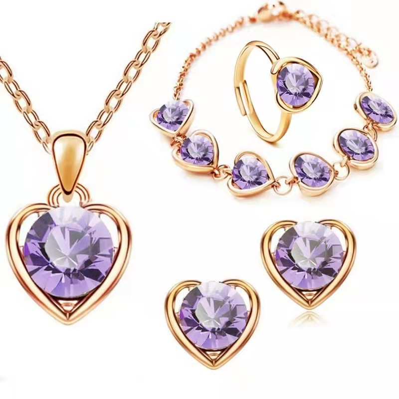 Venta caliente transfronteriza joyería en forma de corazón de cristal traje personalidad femenina temperamento corazón collar pendientes anillo pulsera conjunto de cuatro piezas