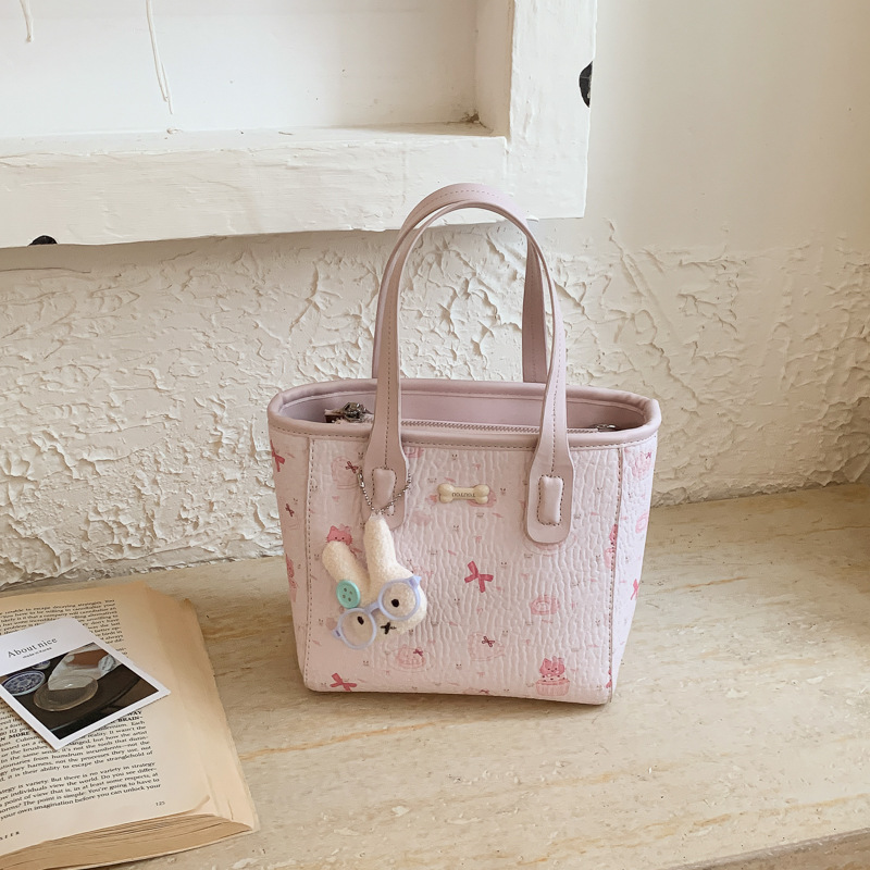 Fresco dulce popular impresión bolsos personalidad extranjera versátil bolsos de mochila de moda diaria bolsos de cubo portátiles