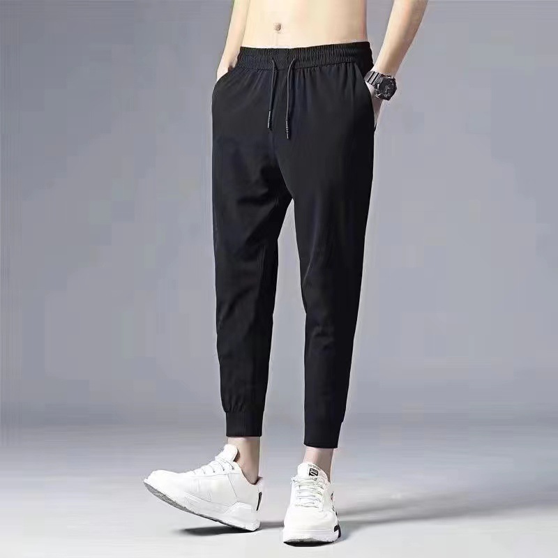 En stock pantalones de invierno de los hombres forrados de lana engrosada pantalones casuales estilo coreano de moda recta suelta más el tamaño de todos los deportes a juego hombres